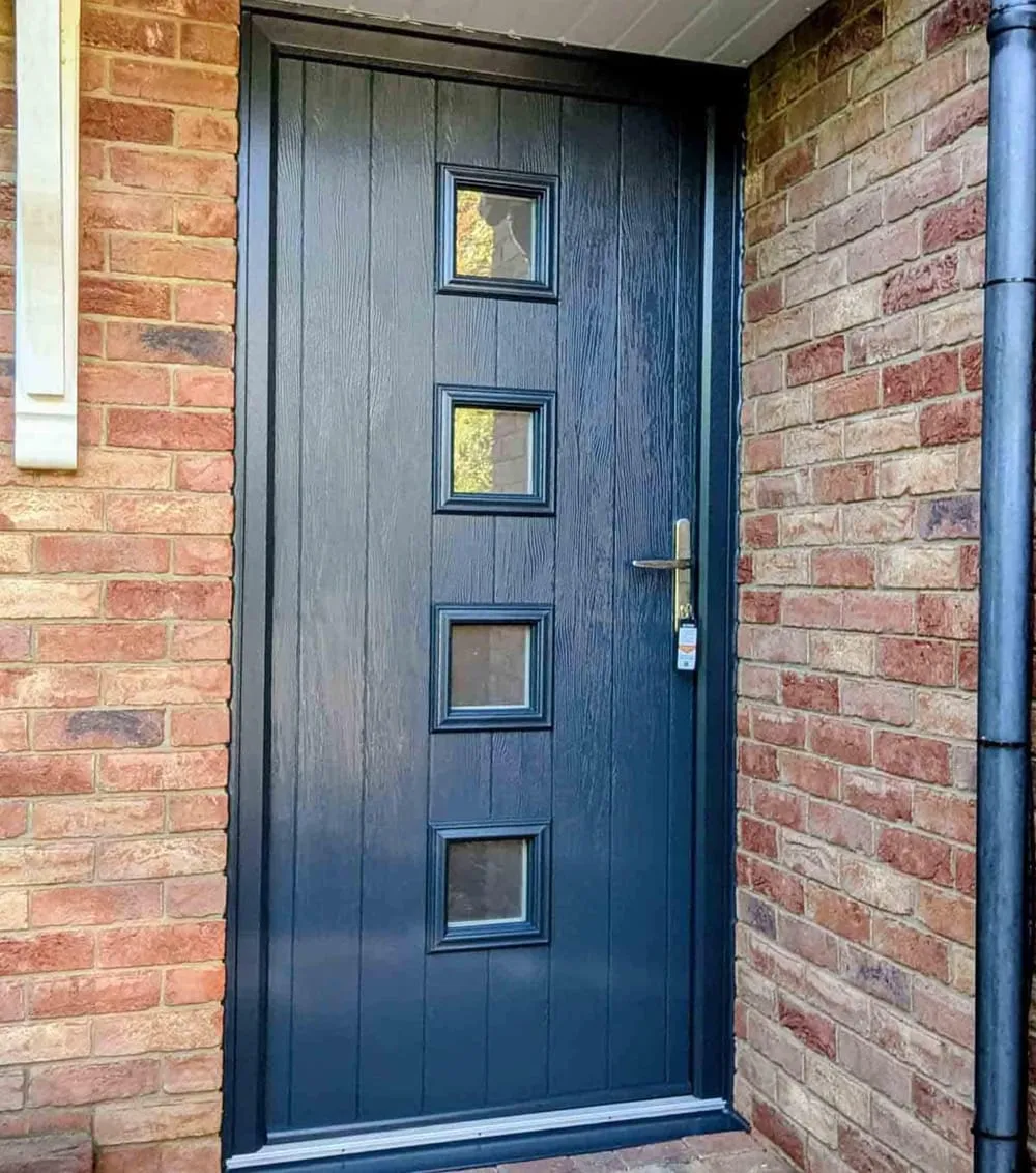 Navy blue composite front door with glazed panel installed by Everglaze Window Solutions Portsmouth