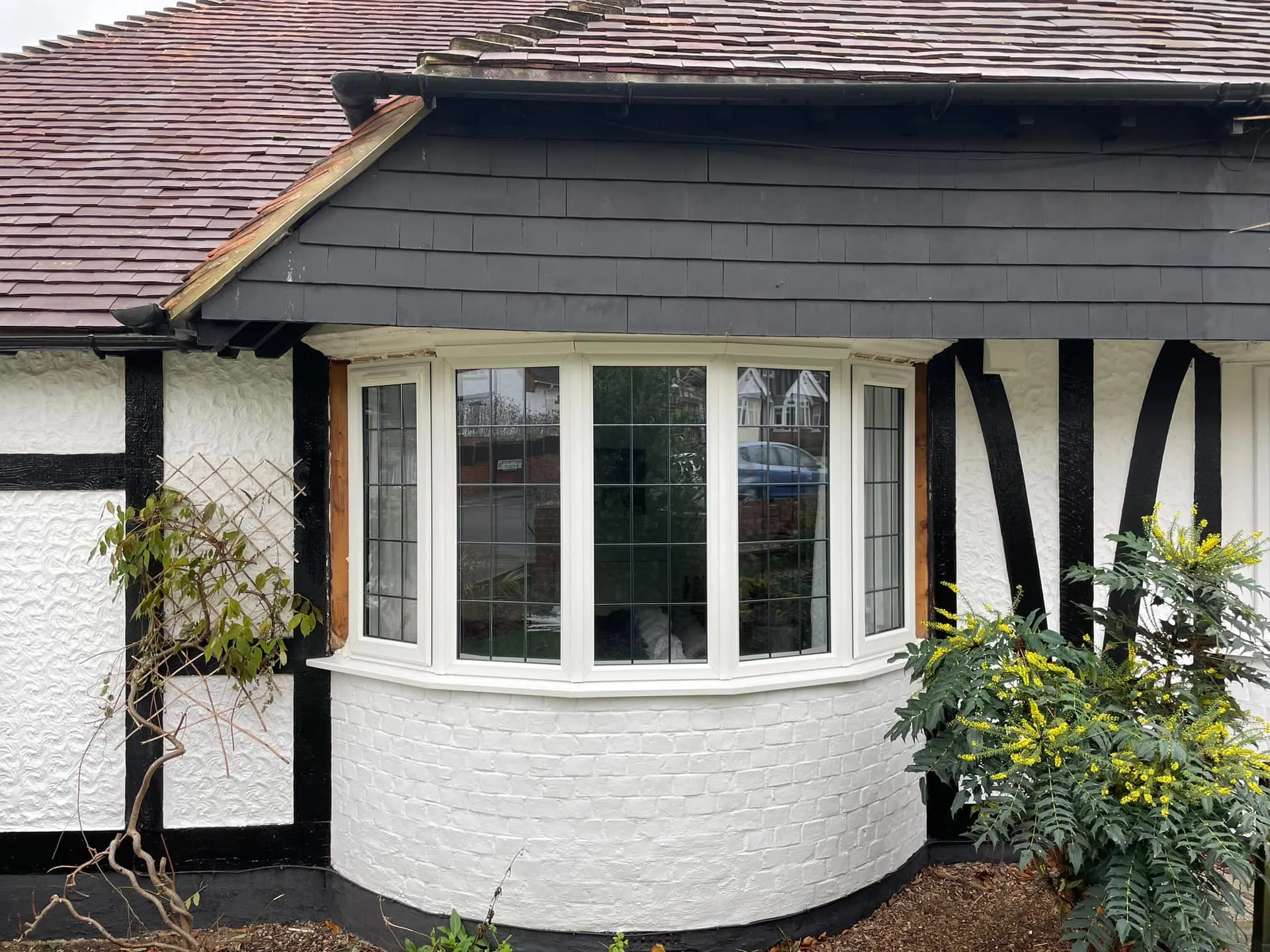 Bay window and porch fitted to a rendered home in Portsmouth by Everglaze Window Solutions